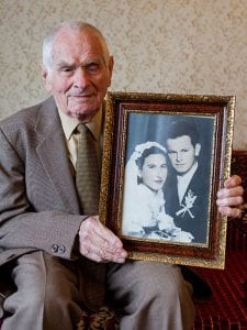80-plus-near-centenarian-man-holding-wedding-photo