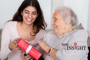 senior-giving-gift-min